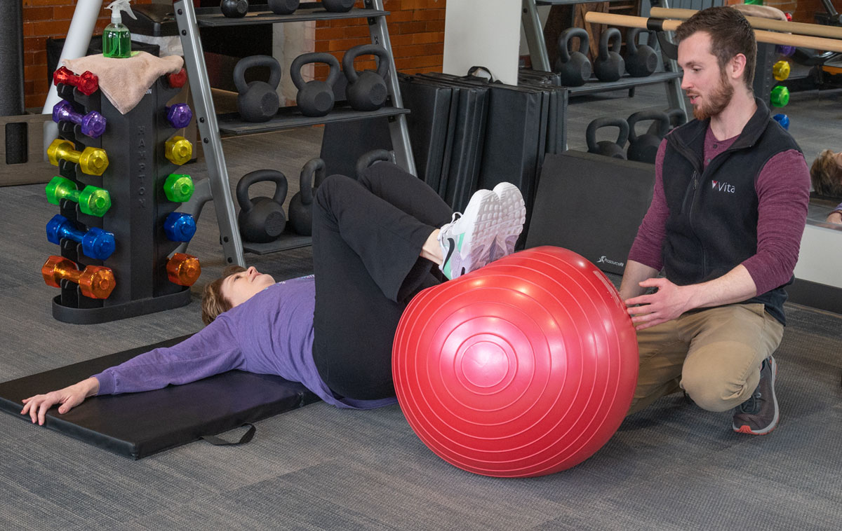 Adam with exercise ball therapy